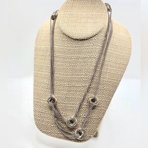 Elegant Silver Tone Necklace with 7 Knot Accents